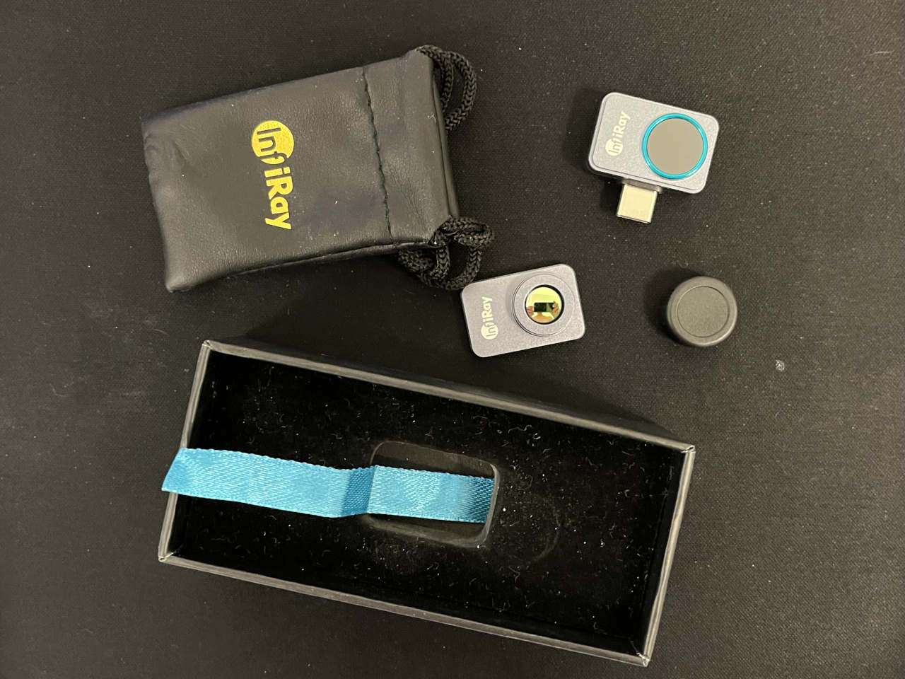 InfiRay P2 Pro thermal camera kit with macro lens, lens cap, protective pouch and packaging.