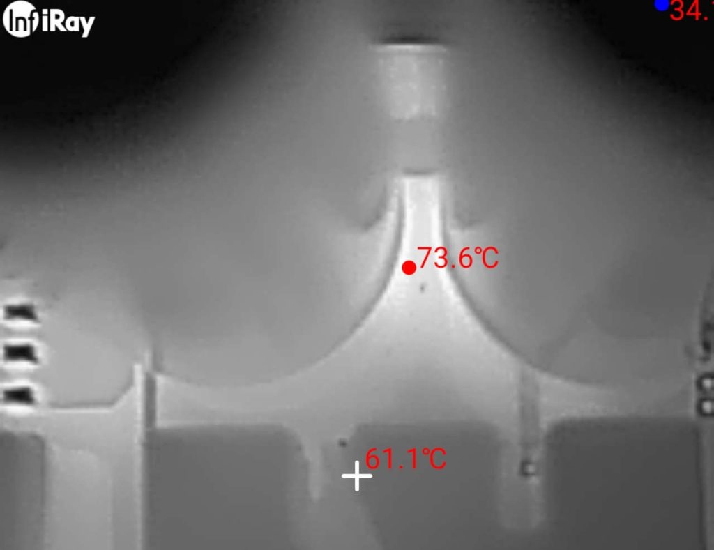 Thermal close-up of the PD-87W charger showing the highest measured temperature of 73.6°C.
