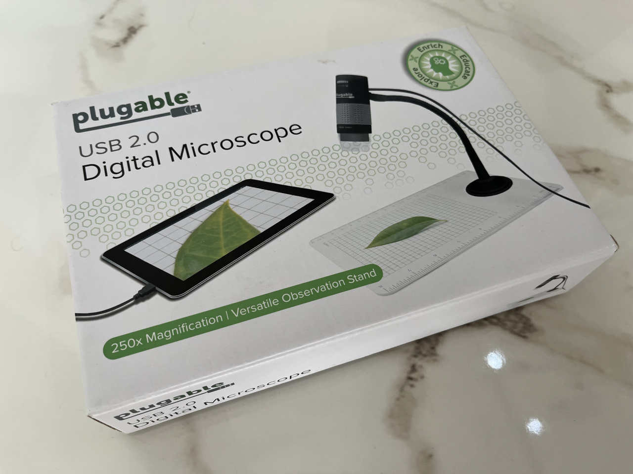 Retail box for the Plugable USB 2.0 Digital Microscope with 250x magnification and observation stand.